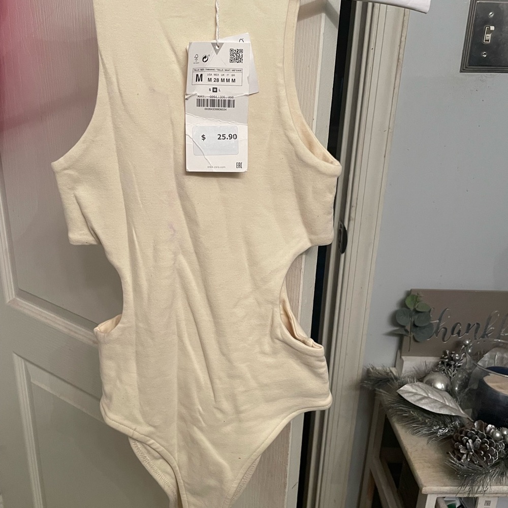 Cream Sleeveless Cutout Bodysuit